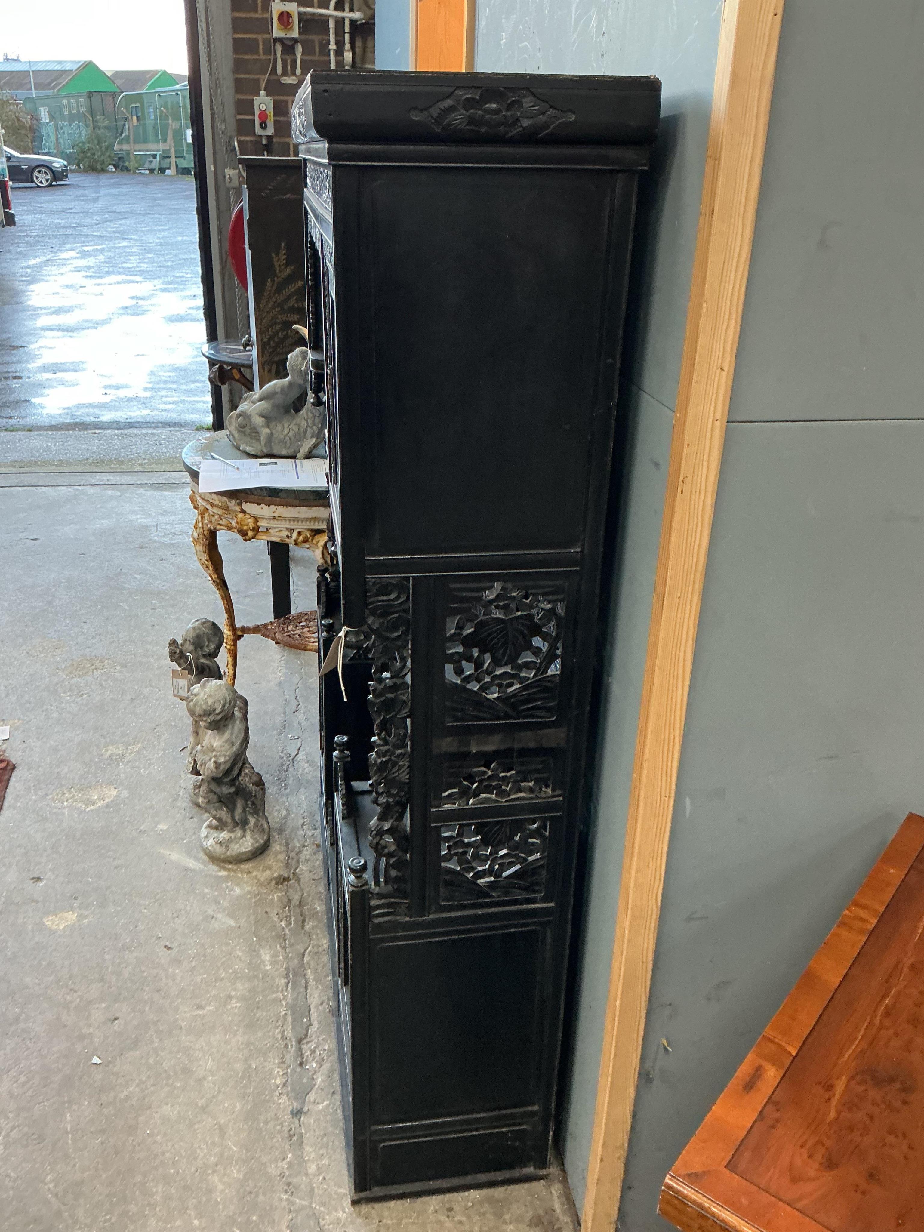 A Japanese Meiji period ebonised cabinet, width 110cm, depth 32cm, height 150cm CITES Submission reference Q4A31H9Q